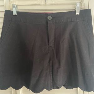 Black skort with scalloped hemline